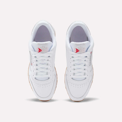Top view of Reebok Classic Leather Shoes with a leather upper, gum soles, white laces, and the gray/red Reebok logo on the tongue, displayed on a plain light background for retro flair.