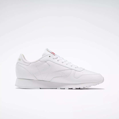 The Reebok Classic Leather Shoes are white low-top sneakers inspired by retro designs, with white laces and subtle branding, shown against a simple light background.