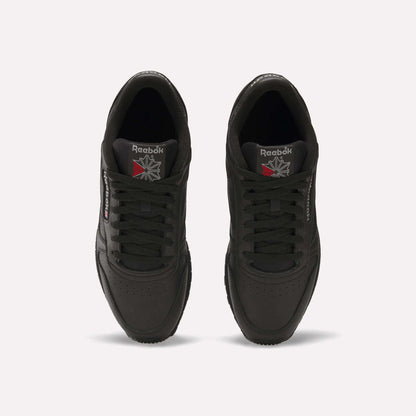 Top view of Reebok Classic Leather Shoes in black, featuring a durable leather upper and iconic Reebok logos on the tongue and side, displayed against a plain white background.