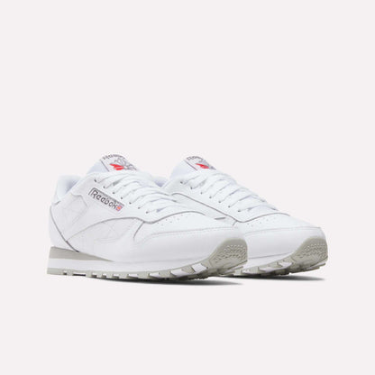 Reebok Classic Leather Shoes in white, featuring grey soles and the iconic Reebok logo with Union Jack on the side and tongue, are displayed on a plain white background for a timeless retro look.