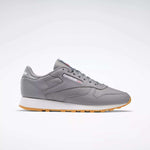 A pair of Reebok Classic Leather Shoes featuring a gray leather upper, white and gum sole, gray laces, and the Reebok logo on the side, shown on a plain white background.