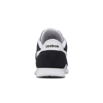 Rear view of the Women's Classic Nylon Shoes by Reebok, featuring a black and white suede design with the classic Reebok logo on the heel, shown against a plain white background.