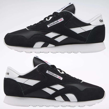 Reebok Women's Classic Nylon Shoes in black feature white soles, side stripes, and logo details on the tongue and heel—versatile sneakers shown from the side against a plain background, ideal for everyday casual outfits.
