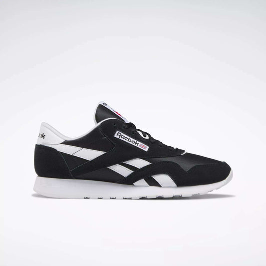 The Reebok Men's Classic Nylon Shoes in black and white feature white side stripes, a white sole, and signature Reebok logos—ideal everyday sneakers for men—displayed in a side profile on a plain light background.