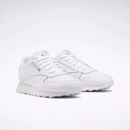 The Reebok Classic Leather Shoes - Big Kids feature a timeless white design with white laces and subtle side and tongue branding—ideal for those who appreciate classic style.