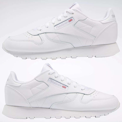 Two white Reebok Classic Leather Shoes - Big Kids are displayed side by side on a plain white background, showcasing the signature design and Reebok logo—ideal as stylish footwear for junior boys.