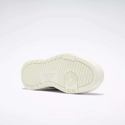 The image displays the sole of a Women's Club C Double Revenge Shoe by Reebok, seen from below. It has a double outsole with a diamond-patterned tread, a circular heel detail, and Reebok branding in the center.