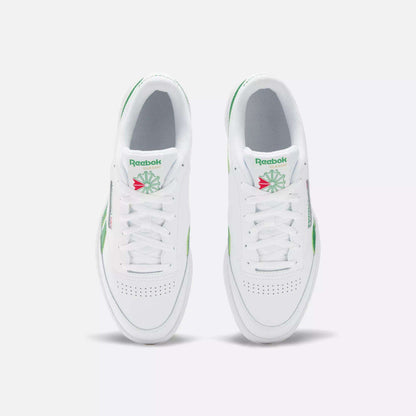 Top view of Reebok Club C Revenge Shoes in white with green and pink accents, laces, perforated toe boxes, and the classic Reebok logo with a green starburst on the tongue—ideal casual leather footwear.