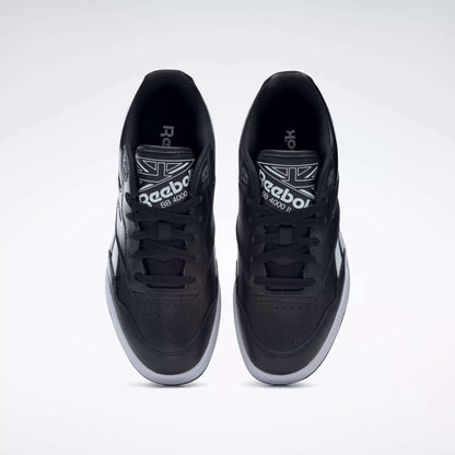 Top view of a pair of Reebok BB 4000 II Shoes in black, showing white soles and laces, the Reebok logo on the tongue, and a clean design set against a light gray background.