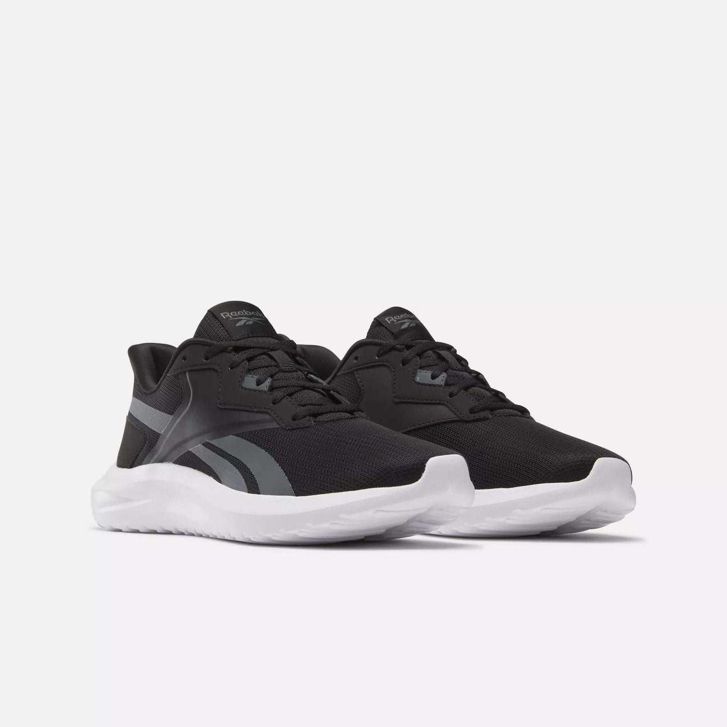A pair of Reebok Men's Energen Lux Running Shoes in black with white soles and gray accents, shown side by side on a plain white background.