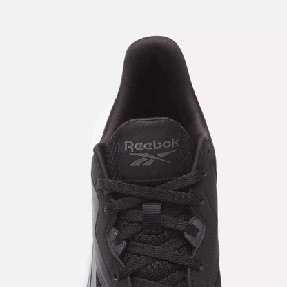 Top view of a black Women's Energen Lux Running Shoe by Reebok with black laces, mesh fabric, and a gray Reebok logo on the tongue. Set against a plain white background.