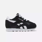 The Kids' Classic Nylon Shoes - Toddler by Reebok feature a black and white suede and nylon upper, white laces, a white sole, and signature Reebok logos on the side and tongue, shown against a plain white background.