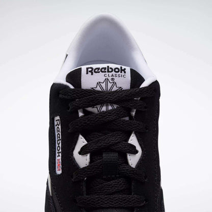 Top view of Reebok Classic Nylon Shoes - Big Kids, in black with white accents, minimalist 80s-inspired design, visible laces, branded tongue, and side label featuring a small Union Jack flag.