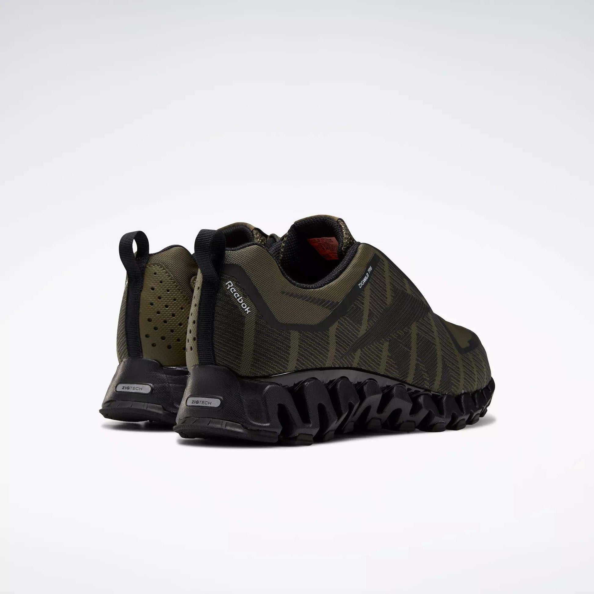 The Reebok Men's ZigWild Trail 6 Shoes feature an olive green and black trail-inspired design, rugged textured outsoles, low-cut profile, heel pull tabs, and enhanced cushioning—all shown against a plain white background.