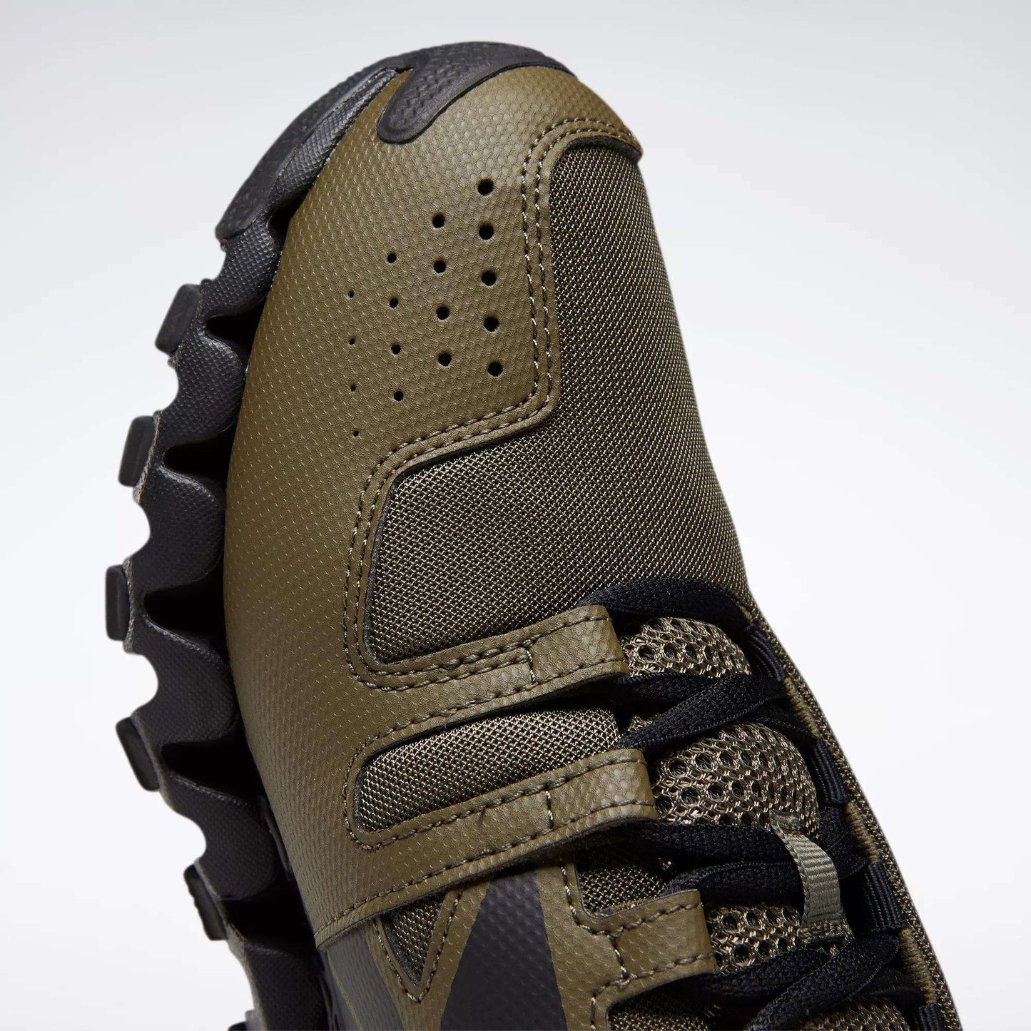 A close-up of Reebok Men's ZigWild Trail 6 Shoes, designed with enhanced cushioning.