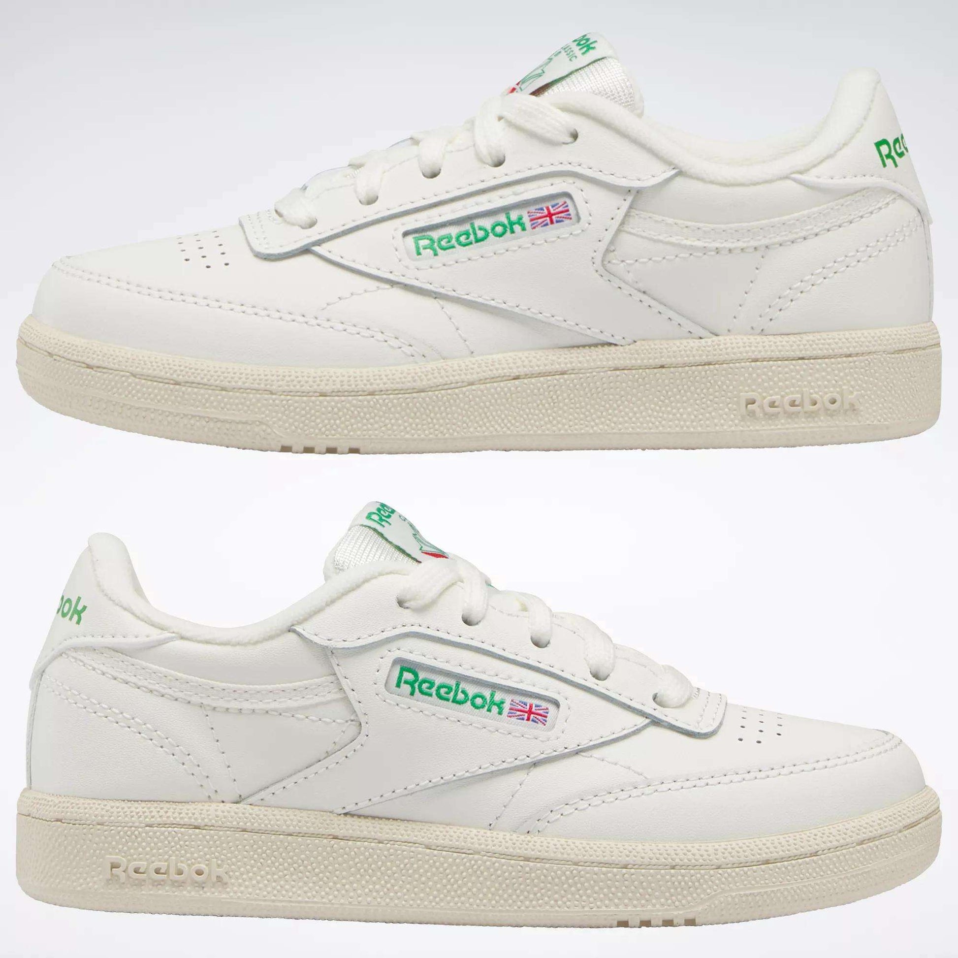 Two white Reebok Kids' Club C Shoes - Preschool, shown from the side with green and red logo details and an off-white sole, bring timeless '80s style for everyday wear.