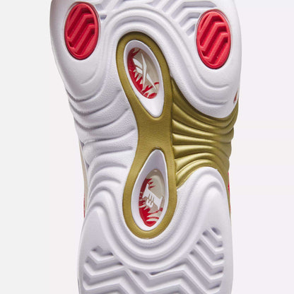 Close-up of the outsole of the Reebok Answer III Basketball Shoes, showing wavy white, red, and gold patterns with circular cutouts. The visible tread texture highlights the unique retro design.