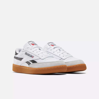 A pair of Reebok Men's Club C Revenge Vintage Shoes in white, featuring black accents, gray suede details, and gum rubber soles, displayed against a plain white background.