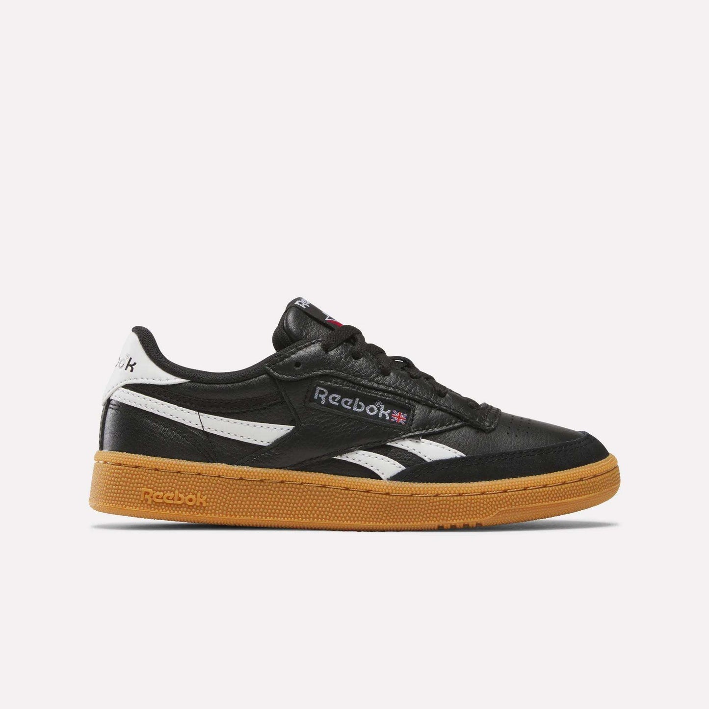 The Reebok Club C Revenge Vintage Shoes feature soft black leather, white branding accents, and a brown gum sole—a stylish men's casual sneaker shown from the side on a plain white background.