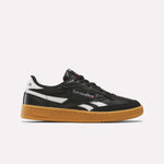 The Reebok Club C Revenge Vintage Shoes feature soft black leather, white branding accents, and a brown gum sole—a stylish men's casual sneaker shown from the side on a plain white background.