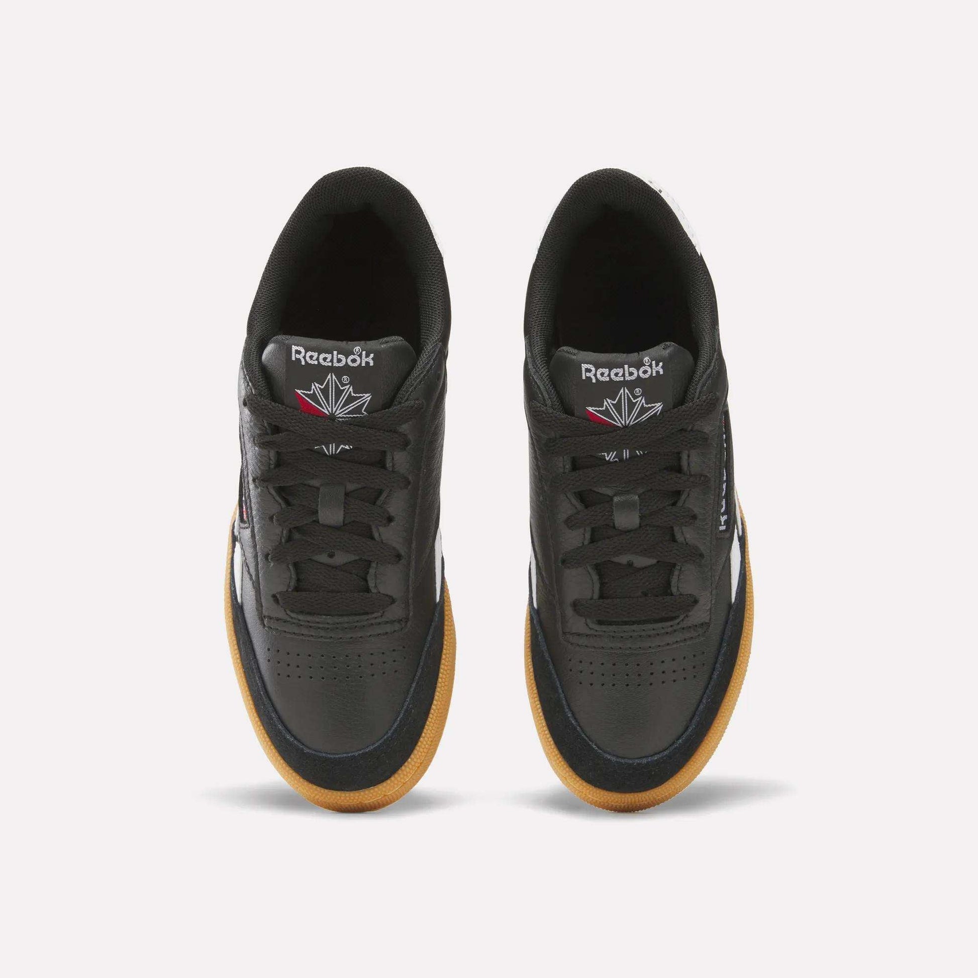 The Reebok Club C Revenge Vintage Shoes are black men's casual shoes made from soft leather, delivering comfort and retro style.