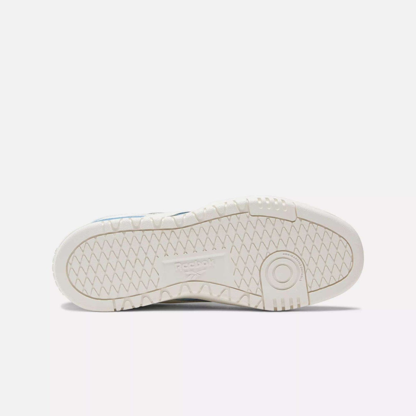 The image shows the white rubber sole of a Reebok Women's Club C Double Revenge Shoe, featuring a geometric tread and embossed Reebok logo in the center, placed sole-up against a plain white background.