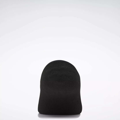 A plain black beanie hat is displayed upright against a simple light gray background, echoing the minimalist style of Women's Reebok Sport Liner Socks 6 Pairs by Reebok.