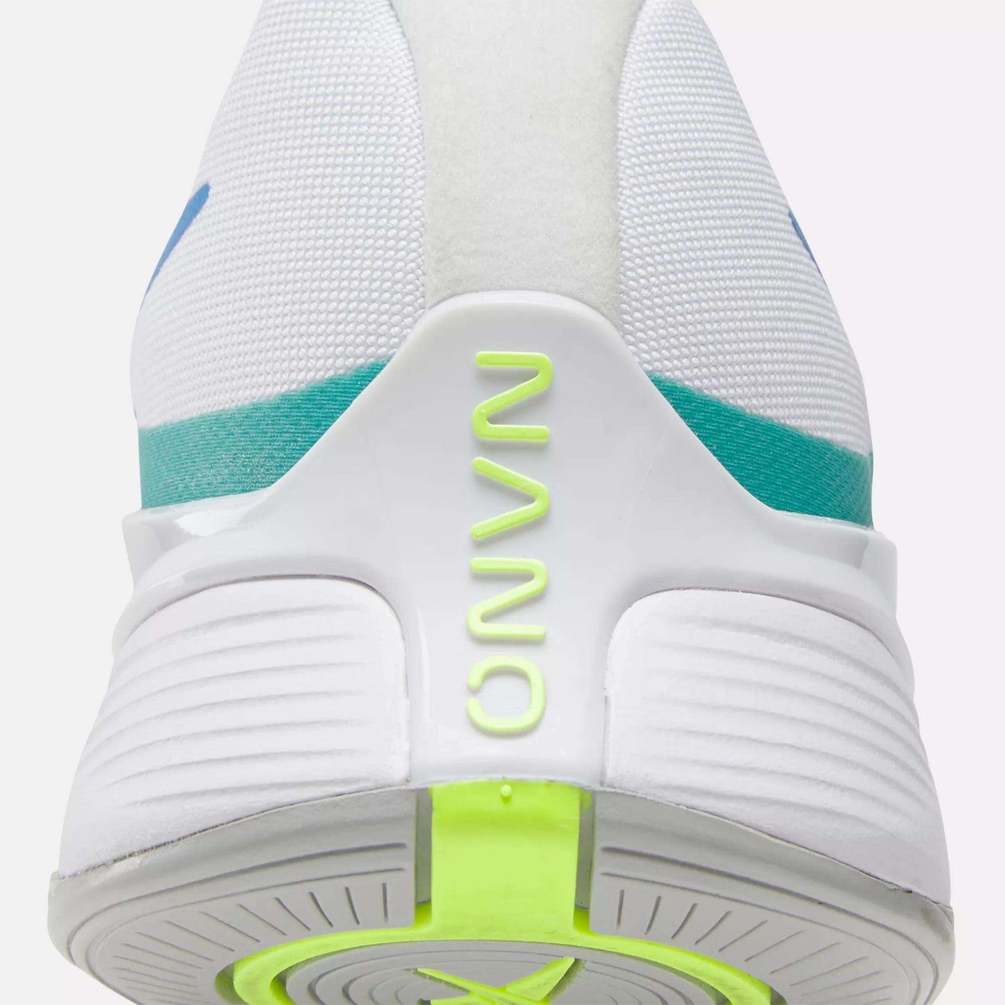 Close-up of the heel of the Reebok Nano X4 Training Shoes, a lightweight white trainer with "NANO" in neon yellow-green on the back, turquoise and blue accents, and a textured white sole featuring a neon green section.