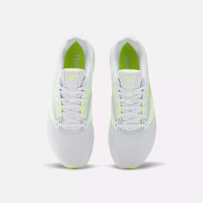 The Reebok Nano X4 Training Shoes are lightweight and white with neon yellow accents, shown from above on a plain white background. They feature breathable mesh uppers and white laces for comfort and style.
