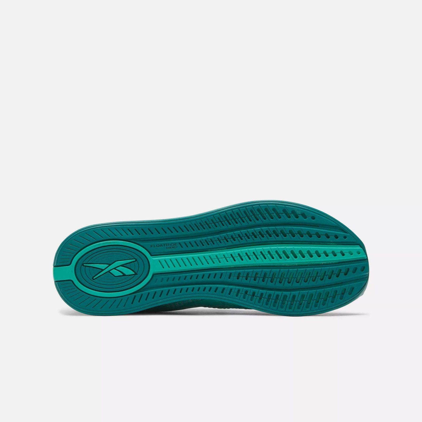 The image displays the green sole of Reebok Women's Nano X4 Training Shoes, featuring a lightweight design, textured tread pattern, and Reebok logo near the heel, set against a plain light background.