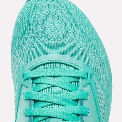Close-up of the toe and laces on the Reebok Women's Nano X4 Training Shoes, featuring a teal mesh upper with synthetic overlays—ideal for lightweight training.