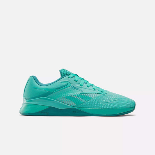 The Reebok Women's Nano X4 Training Shoes in teal feature a low-cut design, mesh upper, and lace-up closure, shown in a side profile on a white background—ideal for anyone seeking lightweight training shoes.