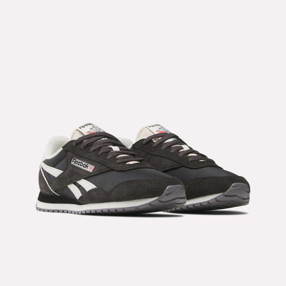 A pair of Women's Classic AZ Shoes by Reebok in black with white accents and gray outsoles, displayed side by side on a plain white background—ideal for retro running shoe enthusiasts.