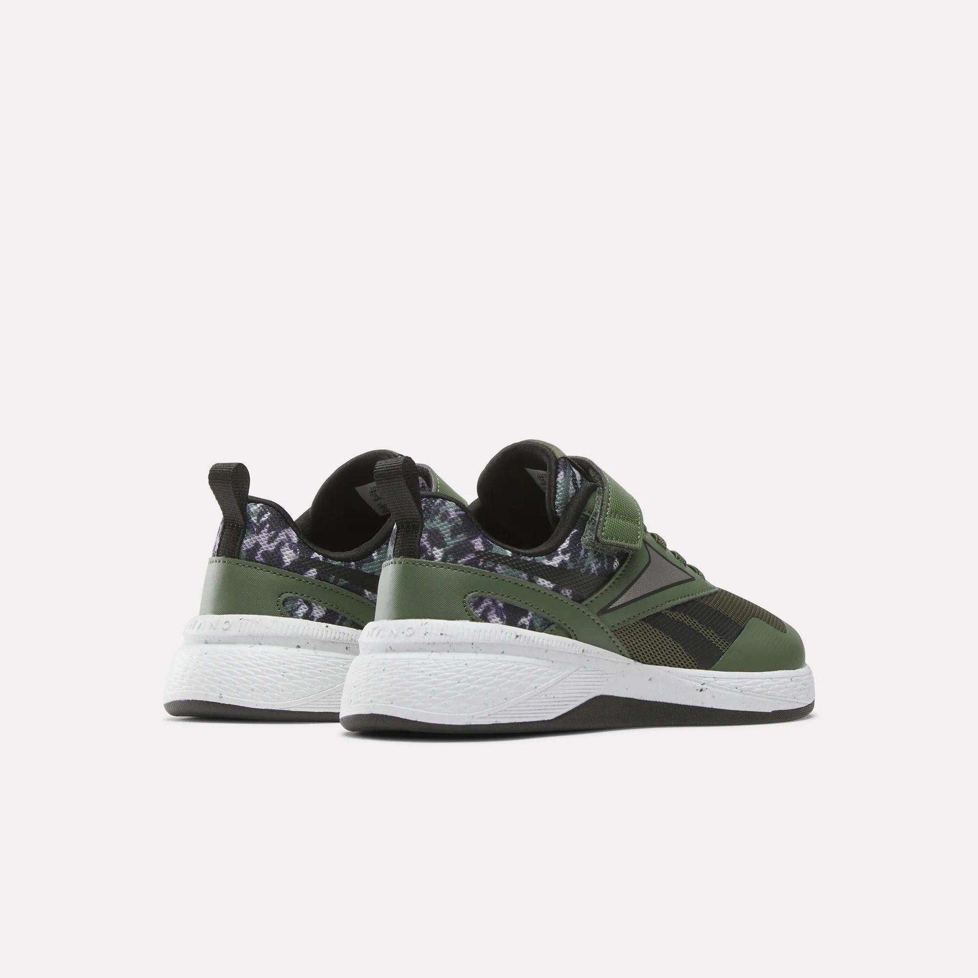 The Reebok Nano Play Stretch Lace And Top Strap Shoes for little kids are shown from the back in green with black and dark camo details, white soles, and black pull tabs—perfect as boys' training shoes in a kid-sized Nano style.