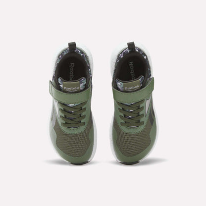 The Reebok Nano Play Stretch Lace and Top Strap Shoes for little kids are shown from above on a white background; they feature green uppers, black soles, white midsoles, mesh details, Velcro straps, and the Reebok logo on the side.