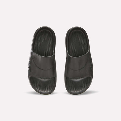 Reebok DMX Recovery Walking Slides in black, shown from above on a white background; feature wide ribbed straps, textured footbeds, and ultra-soft foam for comfort.