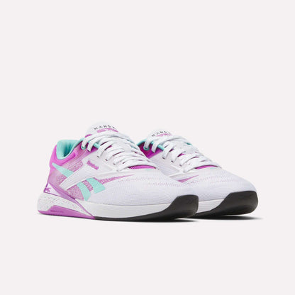 The Reebok Women's Nano X5 Training Shoes feature white mesh uppers with pink, purple, and teal accents, black soles, and are shown side by side on a plain white background.