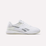 The Reebok Women's Nano X5 Training Shoes are comfortable white sneakers with light gray accents, a textured sole, and the Reebok logo on the side—stylish and perfect for any workout. Shown in side profile against a plain white background.
