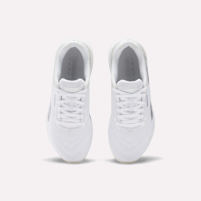 A pair of comfortable white Reebok Women's Nano X5 Training Shoes viewed from above on a plain light background, highlighting the laces, mesh texture, and Reebok branding on the insoles.