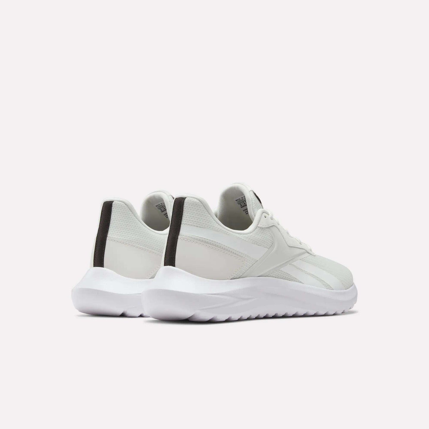 A pair of Men's Energen Lux Running Shoes by Reebok in white with black heel accents, displayed from the back on a plain light background—ideal for workouts and everyday style.