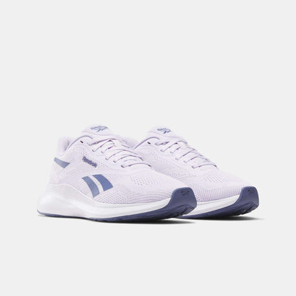 The Reebok Women's Energen Run 4 Running Shoes feature a breathable mesh upper, light purple color with dark purple accents and soles, shown on a white background.