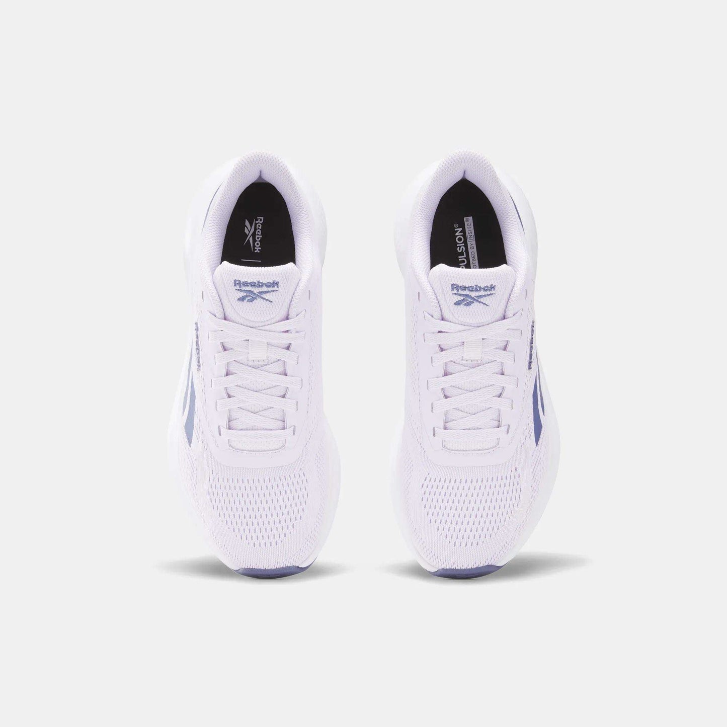 A top view of Reebok Women's Energen Run 4 Running Shoes with purple accents, shown on a light gray background. These shoes feature a lightweight, breathable mesh toe and lace-up closures.
