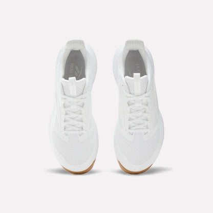 A pair of Reebok Nano Golf Shoes in white, featuring white laces, mesh details, and lightweight FlexWeave for breathability. Tan-colored outsoles appear at the toe. Shown from above on a plain white background.