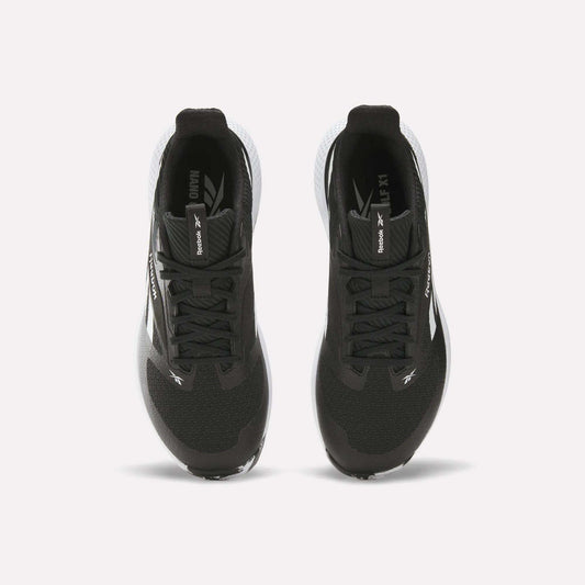 Top view of a pair of black Reebok Nano Golf Shoes with white soles, performance foam cushioning, and Reebok branding on the tongues and sides, positioned side by side on a white background.