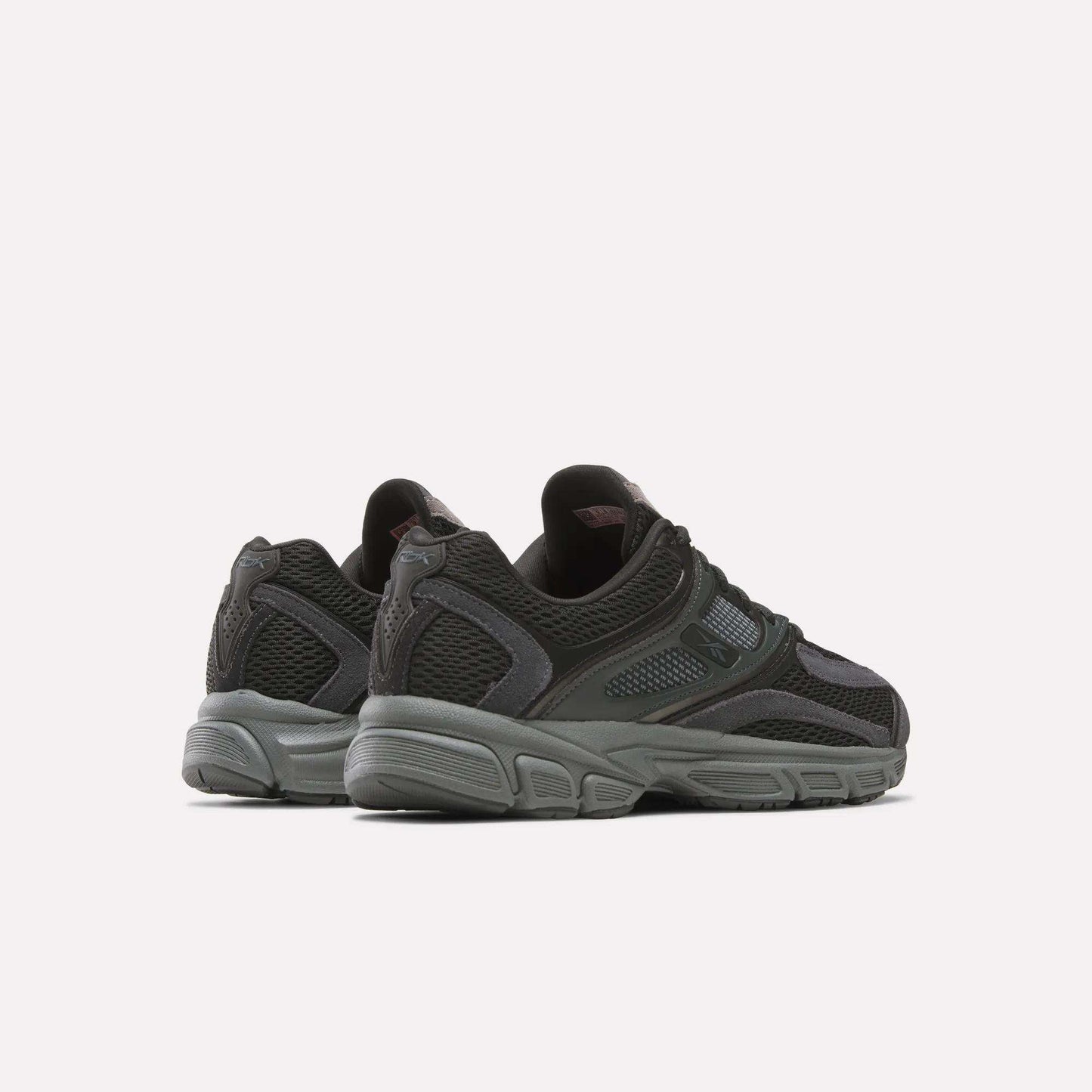 The Reebok Premier Trinity Shoes are stylish black retro runners, ideal for those seeking both comfort and fashion.