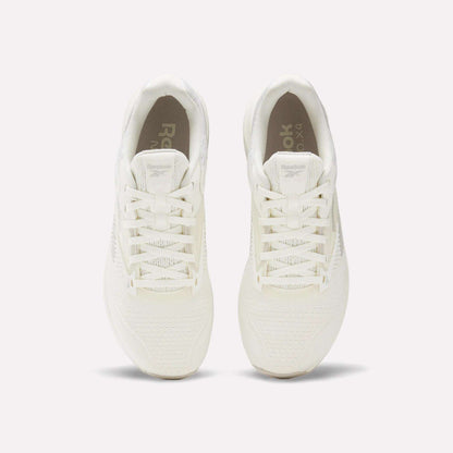 Top view of a pair of white Reebok Nano X4 Training Shoes with laces, placed side by side on a light, neutral background.