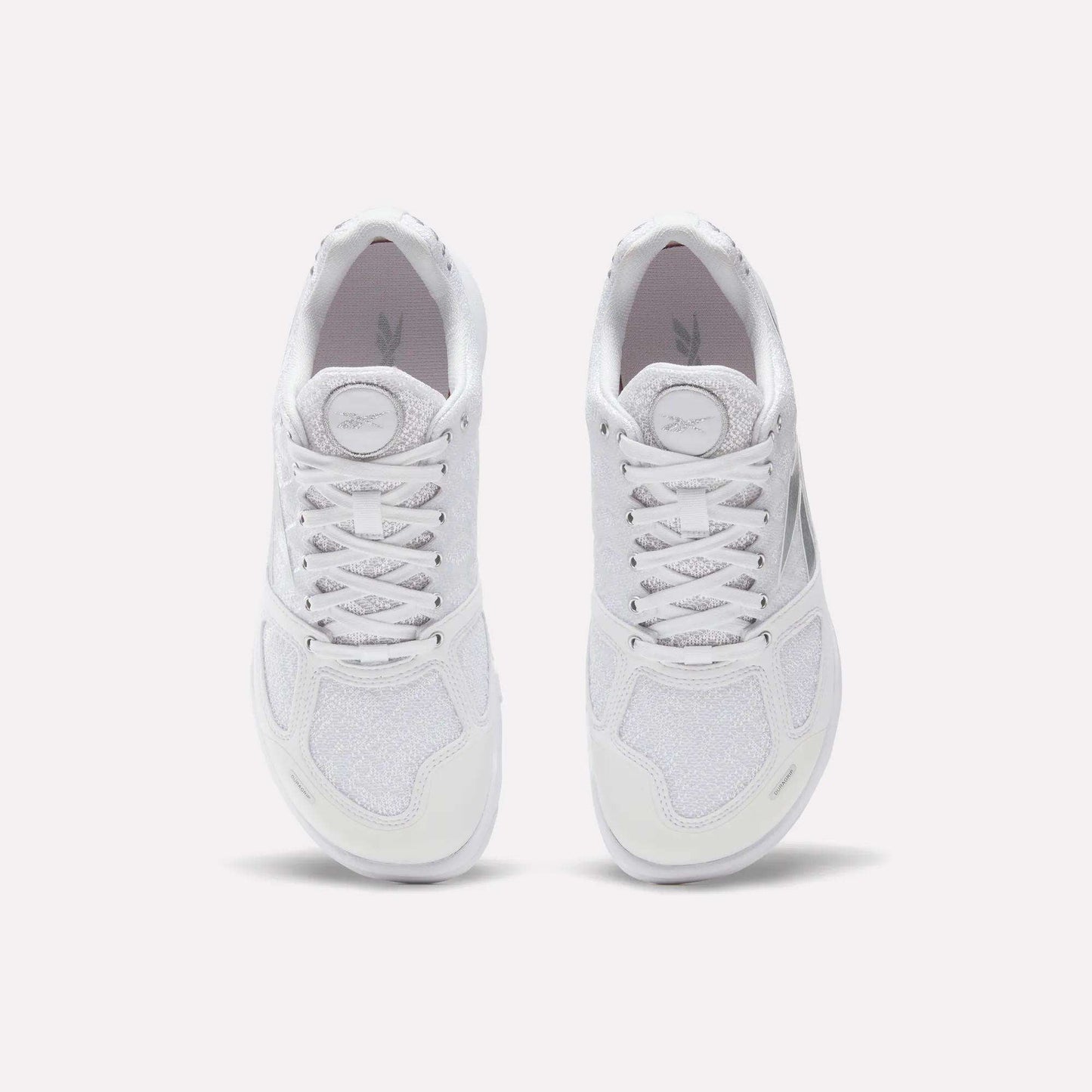 A pair of white Reebok Women's Nano 2.0 Training Shoes viewed from above on a light background, laces tied and soles down—ideal for women's functional fitness routines.