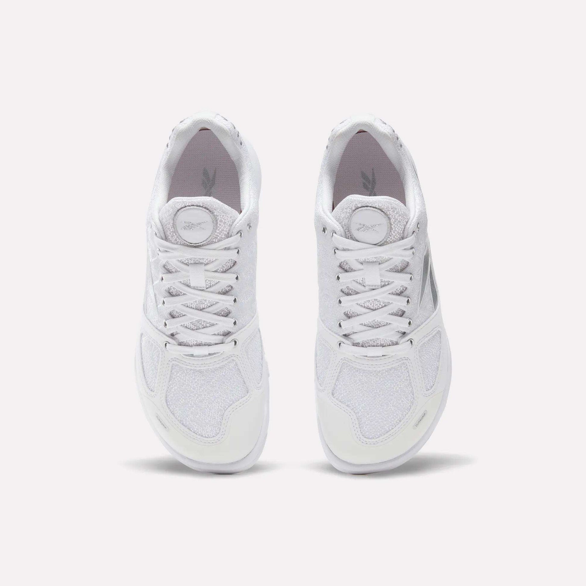 A pair of white Reebok Women's Nano 2.0 Training Shoes viewed from above on a light background, laces tied and soles down—ideal for women's functional fitness routines.
