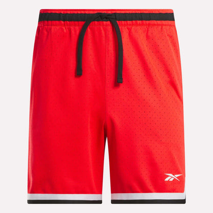 The Men's Basketball Transition Shorts 7" by Reebok feature a bright red design, black drawstring waistband, small white logo on the left leg, and black/white trim. Made of breathable perforated mesh for comfort and style on the court.