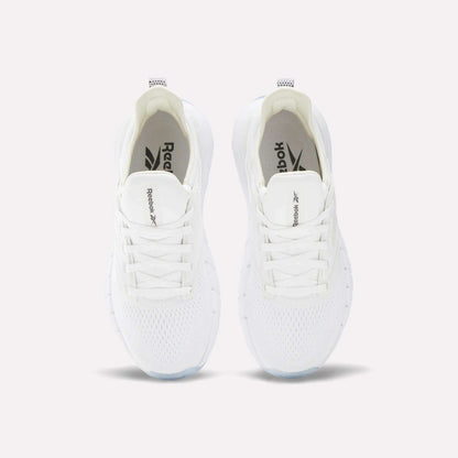 A pair of Women's Nano Gym Training Shoes by Reebok in white, shown from above with visible laces, mesh upper, and Reebok branding on the tongue and insole.